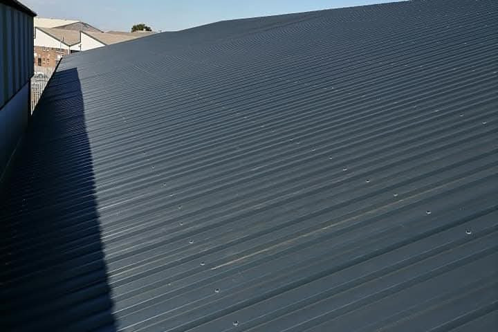 solar pv and turbine ventilators industrial factory roof after